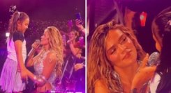 Karol G en tarima con una niña. Foto: Capturas de video. El Colombiano.